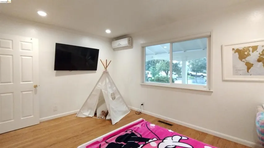 Rec room featuring light wood finished floors and recessed lighting