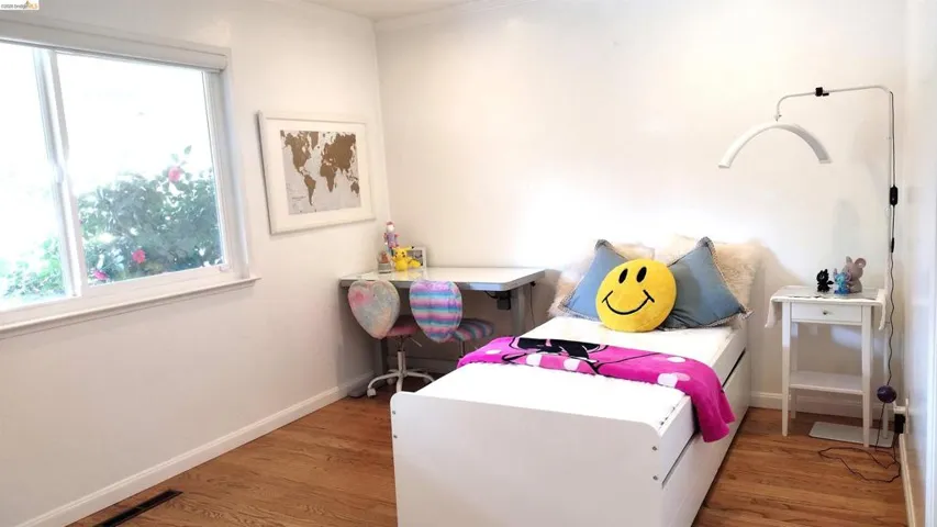Bedroom with light wood-style flooring