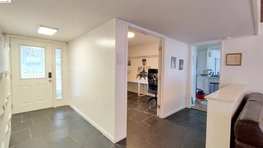 Entrance foyer featuring baseboards
