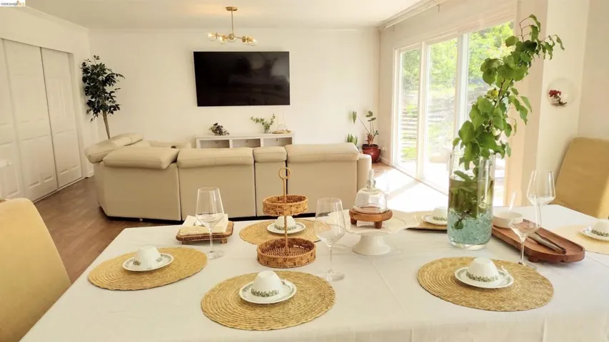 Dining room with a chandelier, ornamental molding, and wood finished floors