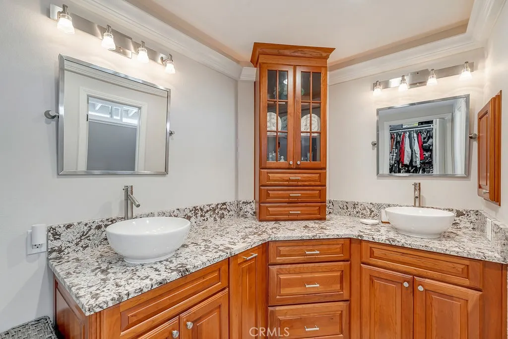 Quality wood custom cabinets, dual mirrors, sinks, light fixtures