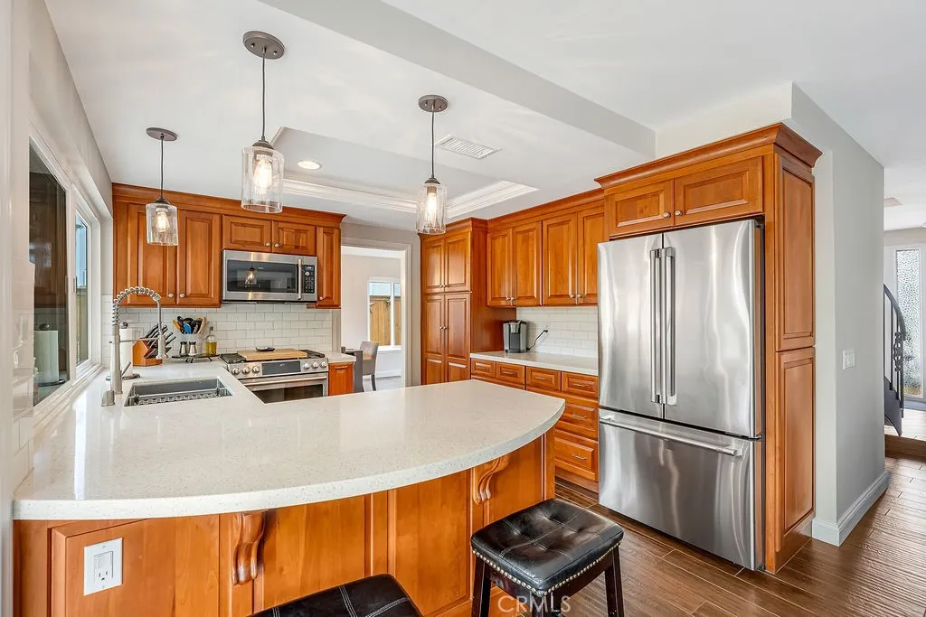 Kitchen with Quartz counters stainless steel appliances,