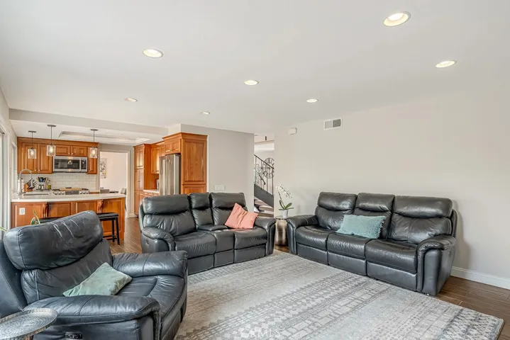 Family room is spacious, has recessed lighting