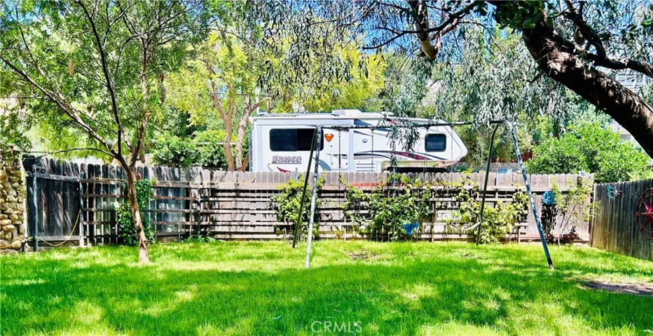 passion fruit along the fence + front parking large enough for RV