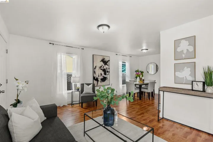 Living area with wood finished floors and plenty of natural light