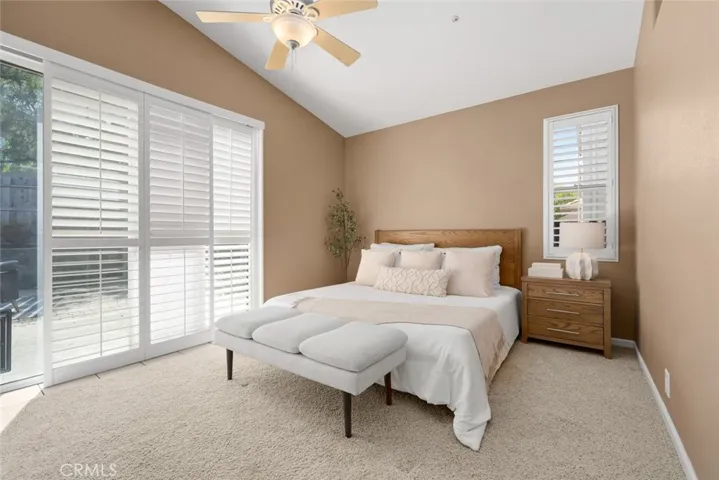 Primary bedroom with slider to backyard