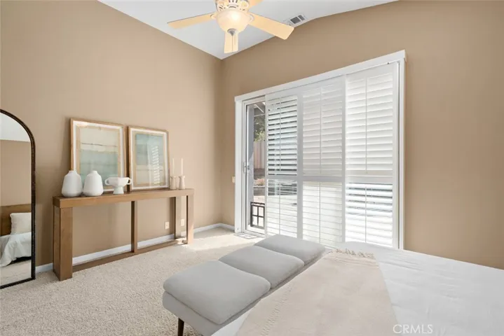 Primary bedroom with slider to backyard