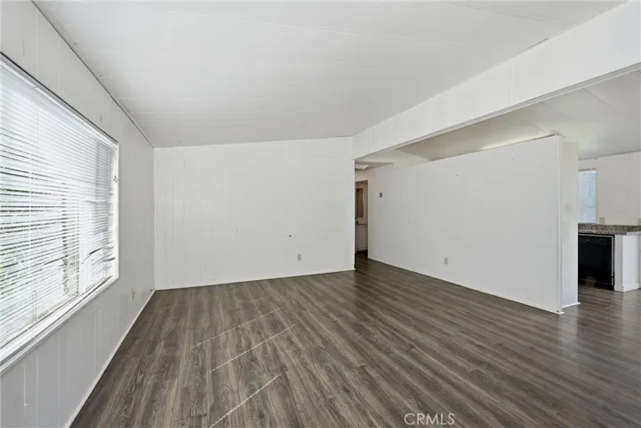 Living room opens to kitchen and dining area
