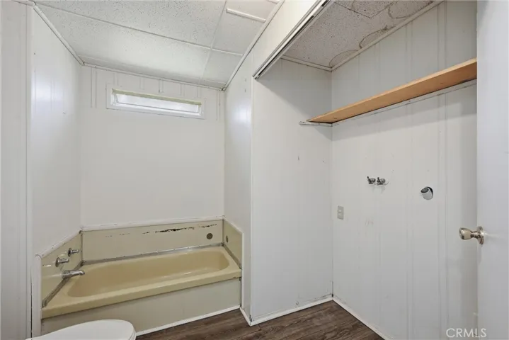 Hall bathroom with laundry closet area