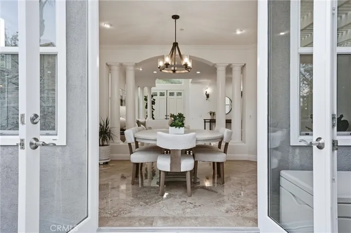 Another view into dining space from outside the french doors