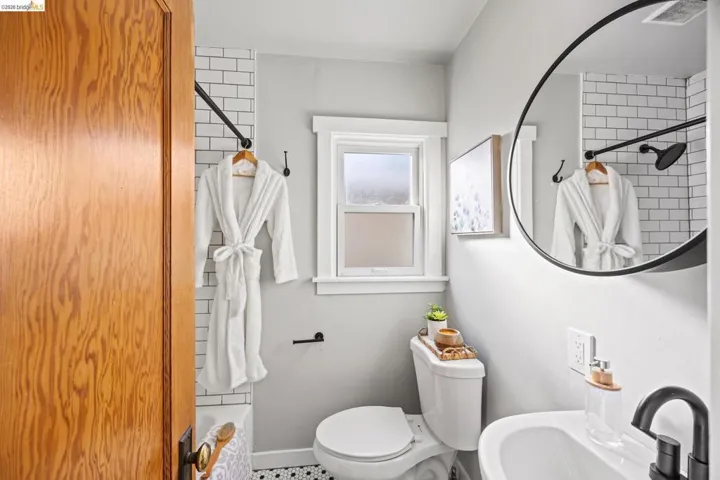 Full bathroom with toilet and shower / tub combo