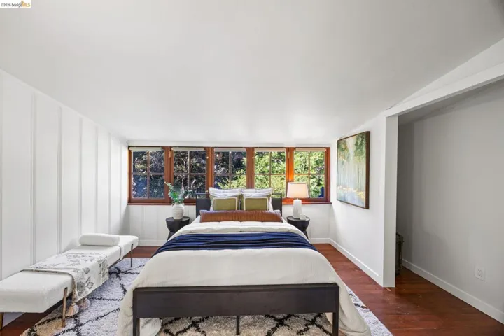 Bedroom featuring dark wood-style flooring