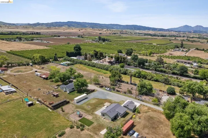 Overview of rural landscape featuring extensive farmland and mountains