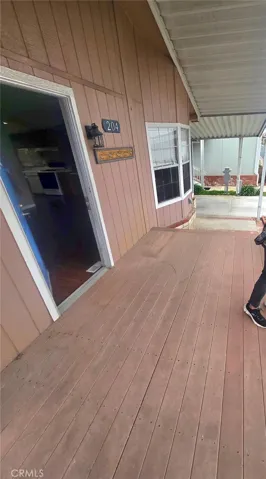 Front porch with TREX decking, Being repainted gray with turquoise door