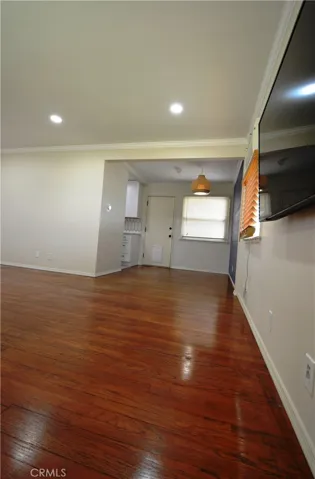 You can see the Formal Dining Room with access door to the back patio.