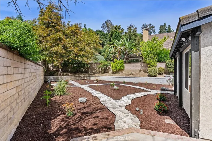 back garden featuring several mature fruit trees