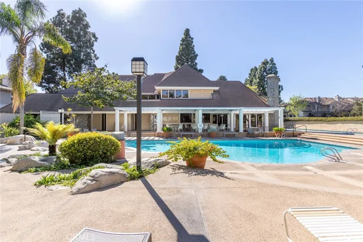 HOA gated pool and clubhouse with kitchen, living, pool and ping pong table