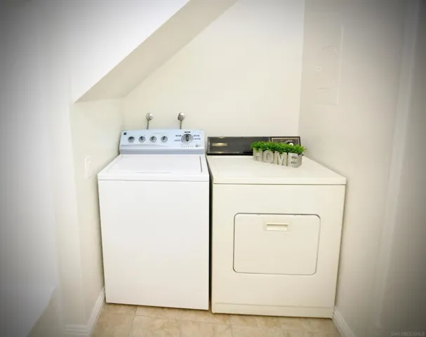 Laundry area located downstairs inside the bathroom.