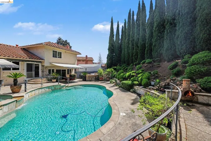 Relaxing pool / spa featuring a patio area