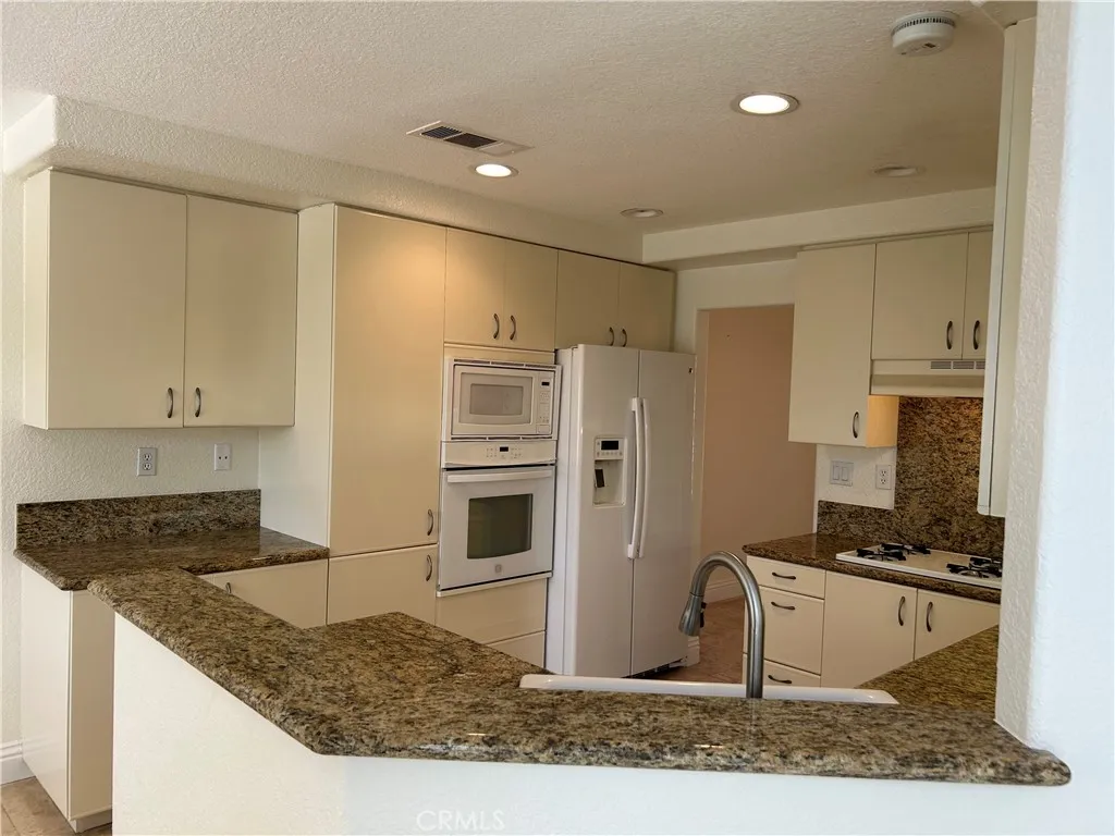 Kitchen and refrigerator