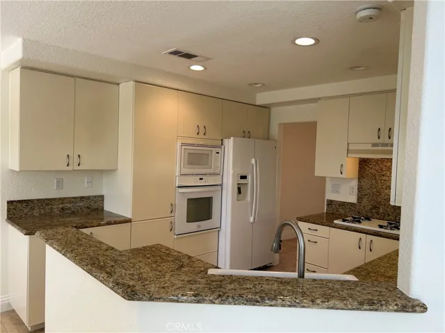 Kitchen and refrigerator