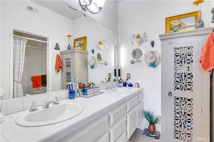 Primary bathroom features double sink and updated fixtures.