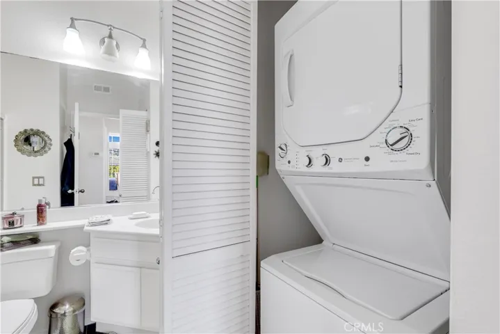 Washer & dryer provides easy access and when inactive, hidden behind doors.