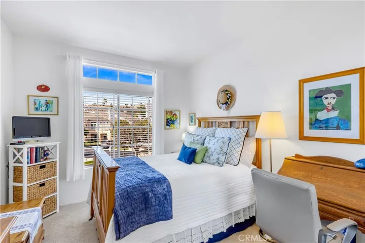 Secondary bedroom, natural sunlight through dual pane windows.
