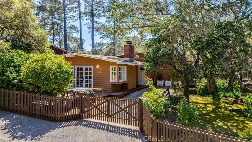 Home View from street - completely gated and fenced yard.