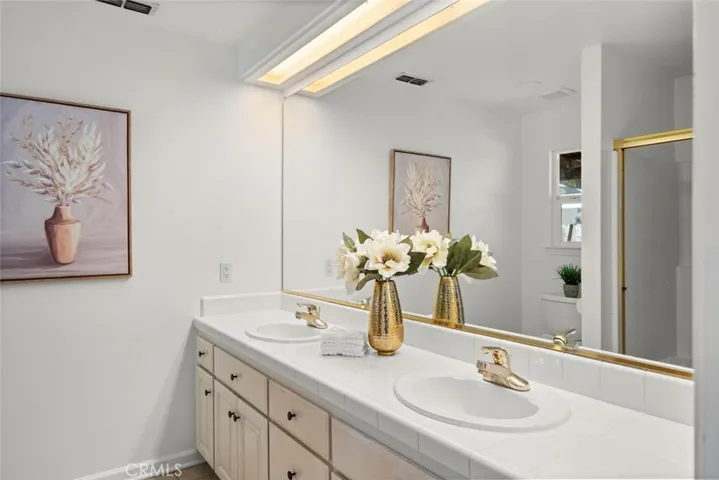 Primary bath with dual sink vanity.