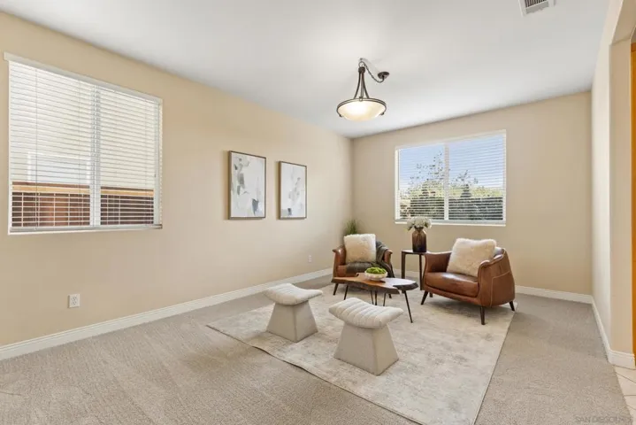 Staged as a sitting room but can be used as a dining room as well