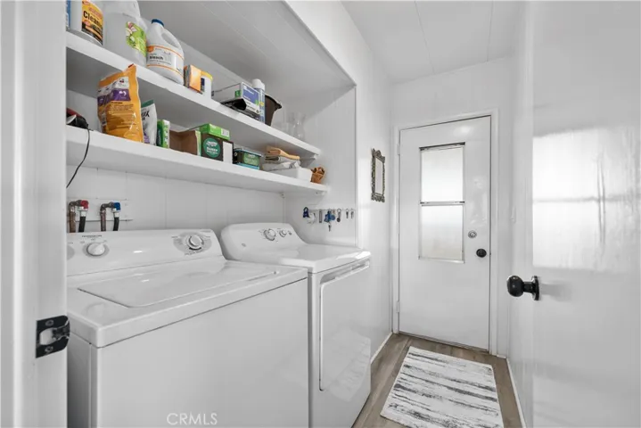 Laundry Room with door to carport area