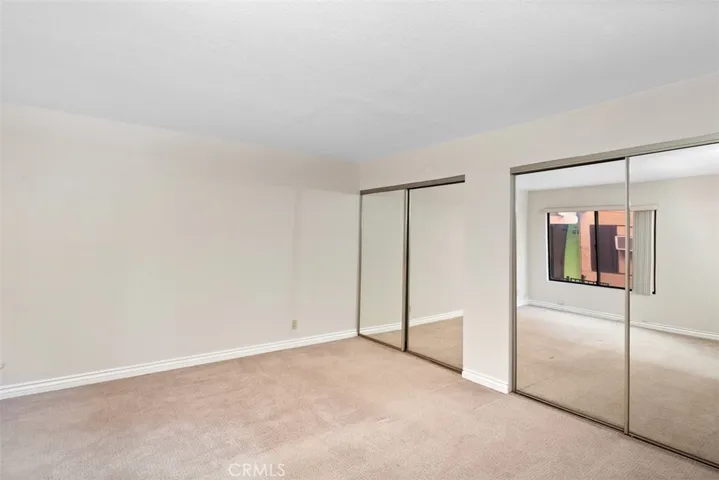 Spacious Bedroom 
with mirrored closets doors