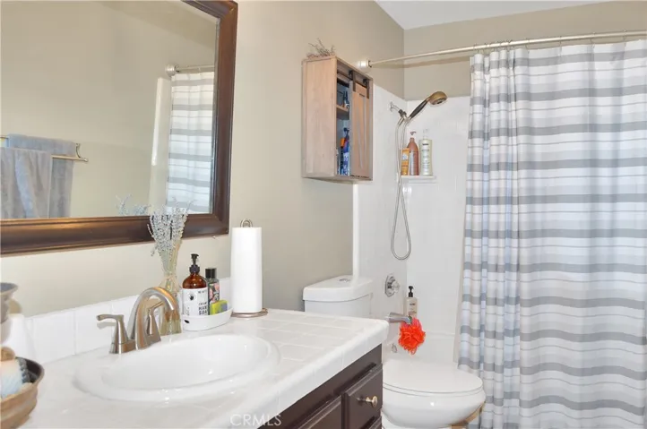 The 3rd full bath offers a shower in tub and is right next to the 4th bedroom so is perfect for guests or multi-generational living.