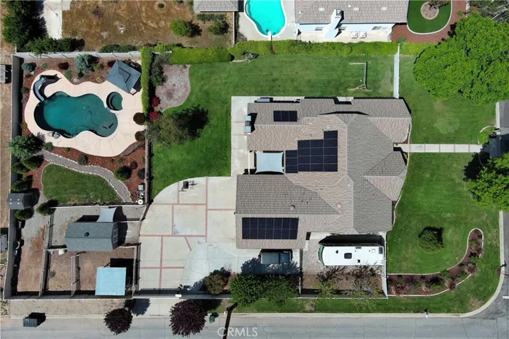 This fabulous half-acre lot offers abundant fenced and cross-fenced backyard space with an automatic gate leading to the 3-car garage, RV parking with hook-ups, plenty of extra driveway parking, an inviting lawn to play on, the sparkling pool and spa area, and a bit of country living with a chicken coop and dog run which both have access to a heated shed to keep them warm and safe. Plus, there's a second drive-through gate to the yard in the back - perfect for projects or extra storage.