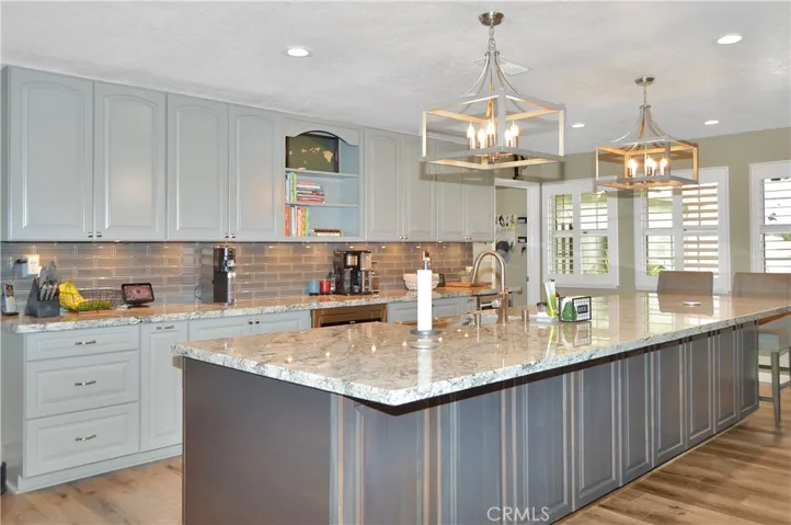 It's not just wasted space on this side of the bar. These are all additional cabinets for added storage.