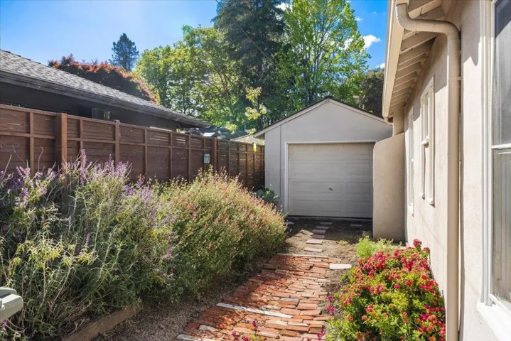 Former driveway now a brick garden path