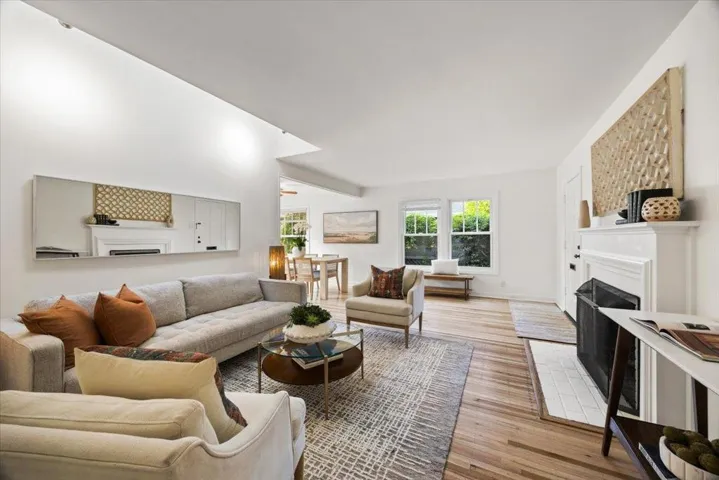 Raised ceiling with skylight/track llghting,oak floors, fireplace.