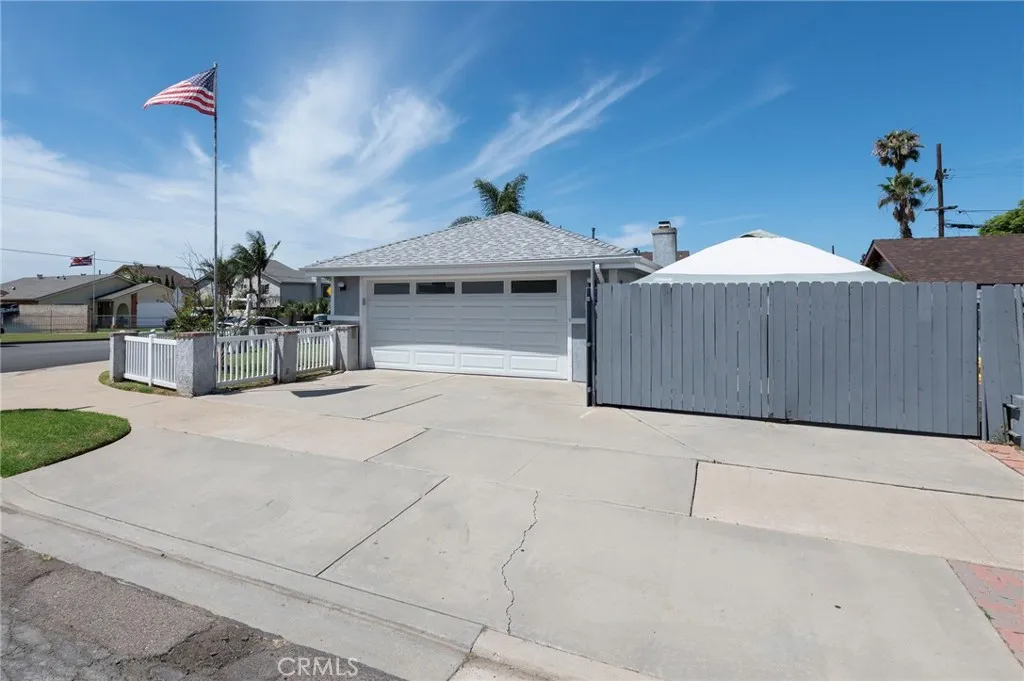 View to 2 car garage and large driveway