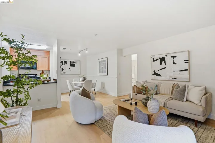 Light wood-finish flooring complements white walls throughout