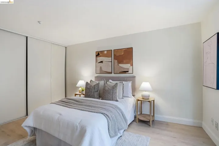 Room featuring light wood-finish flooring, white baseboards, and neutral wall paint