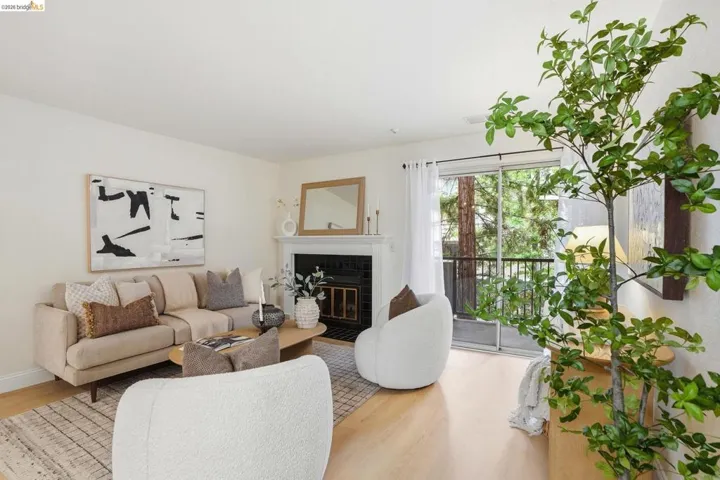 Light wood-finish flooring complements the neutral wall tones
