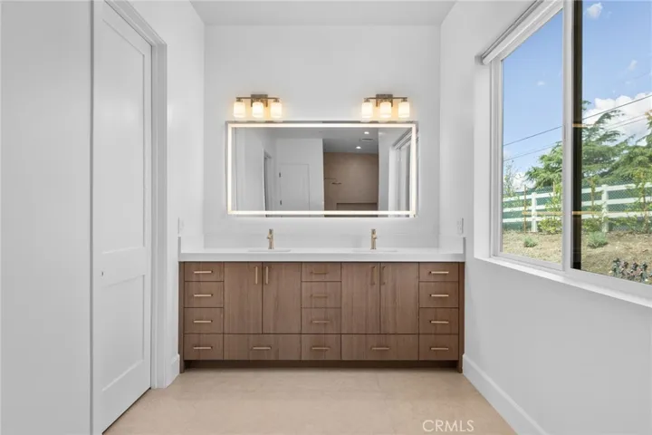 Dual Sinks & Entry to Walk-in Closet