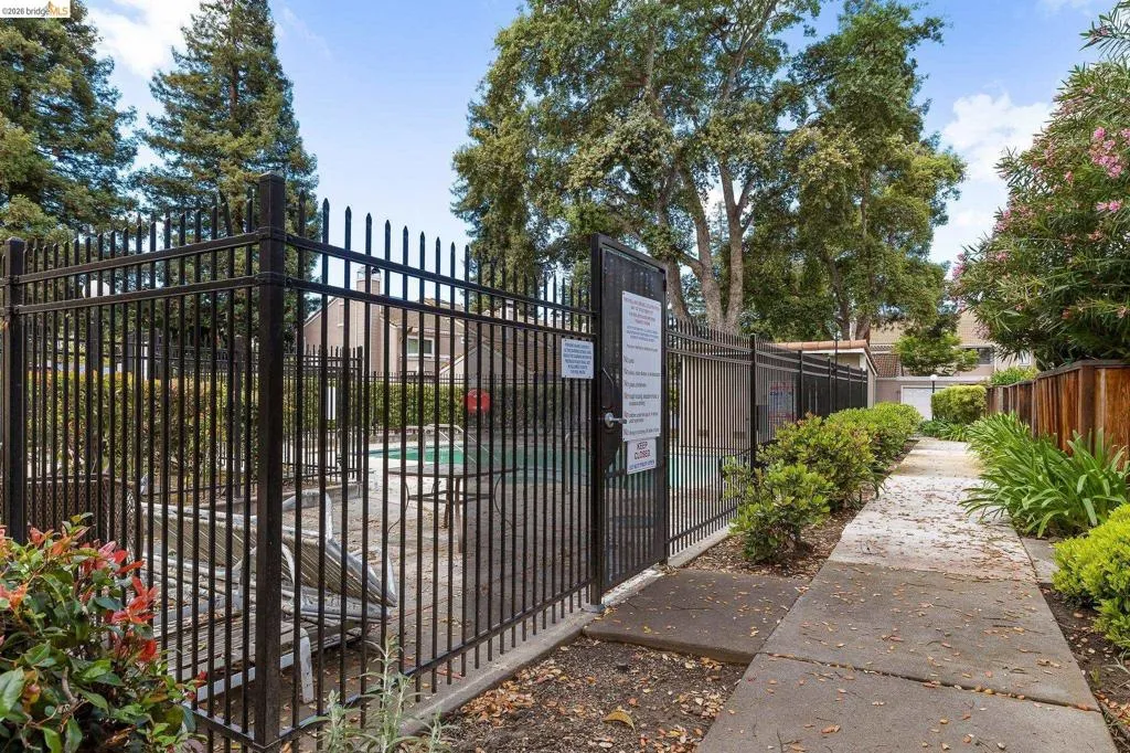 Gate featuring a community pool