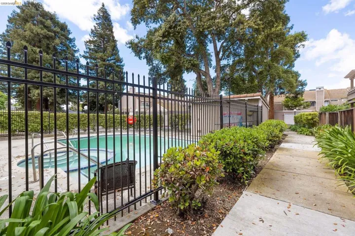 Community pool with a patio