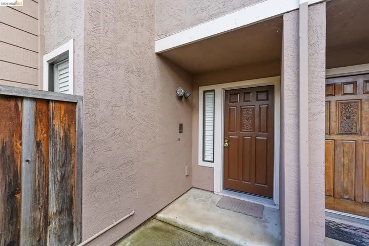View of exterior entry with stucco siding
