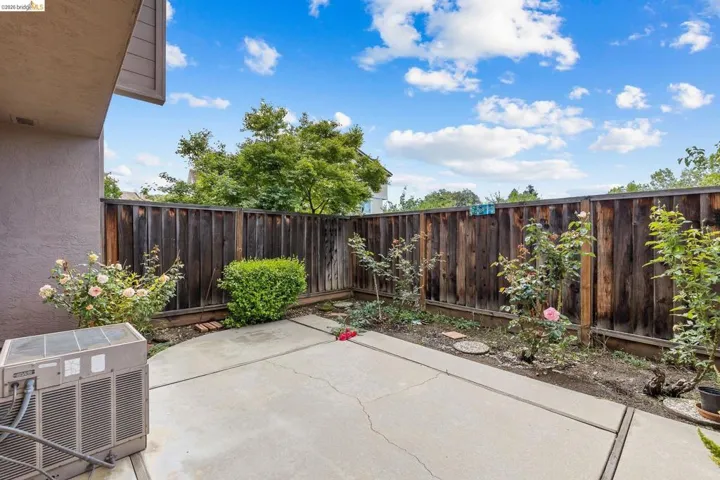 Fenced backyard with a patio area