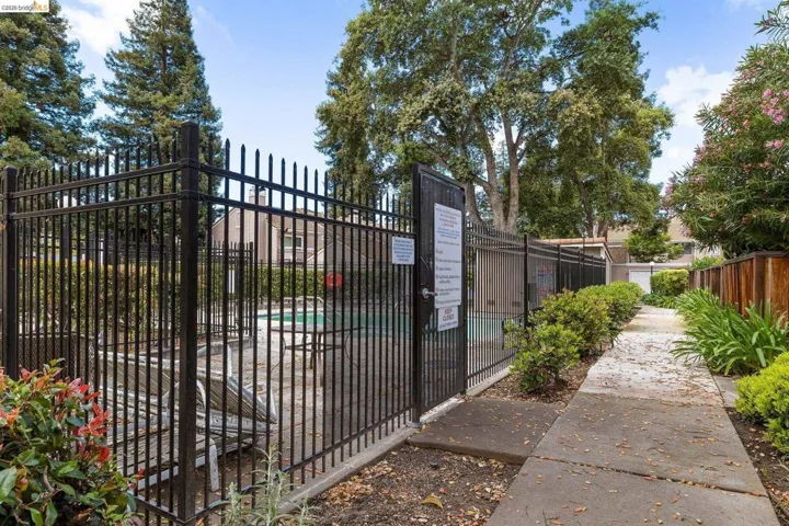 Gate featuring a community pool