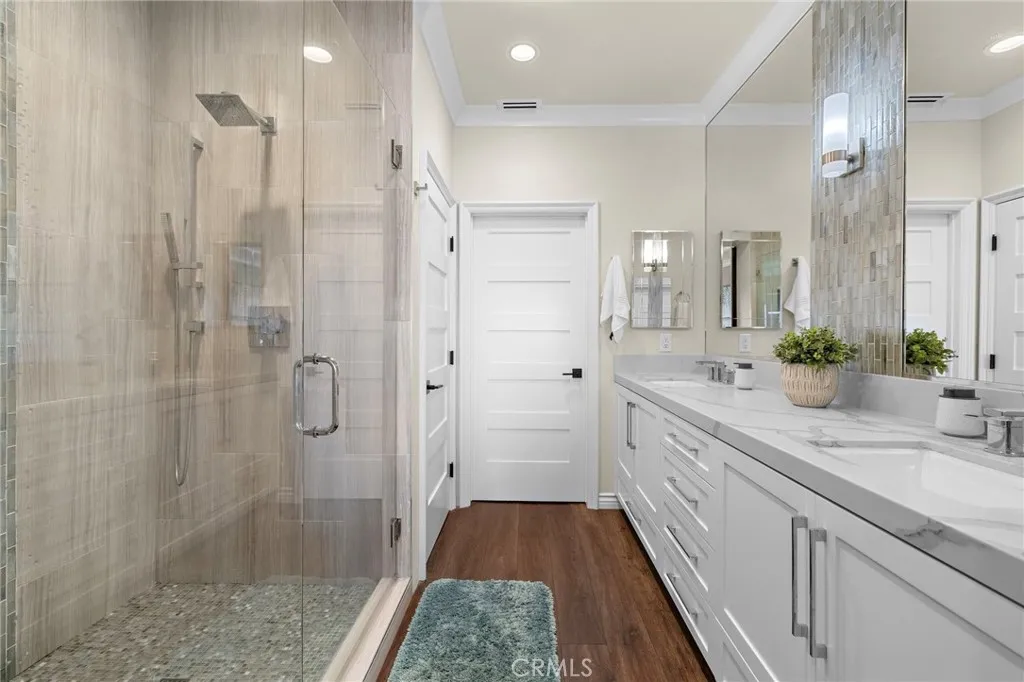 Completely redone primary bathroom with massive counter space and storage and the prettiest shower imaginable!