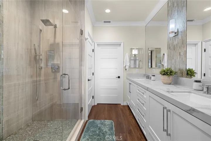 Completely redone primary bathroom with massive counter space and storage and the prettiest shower imaginable!